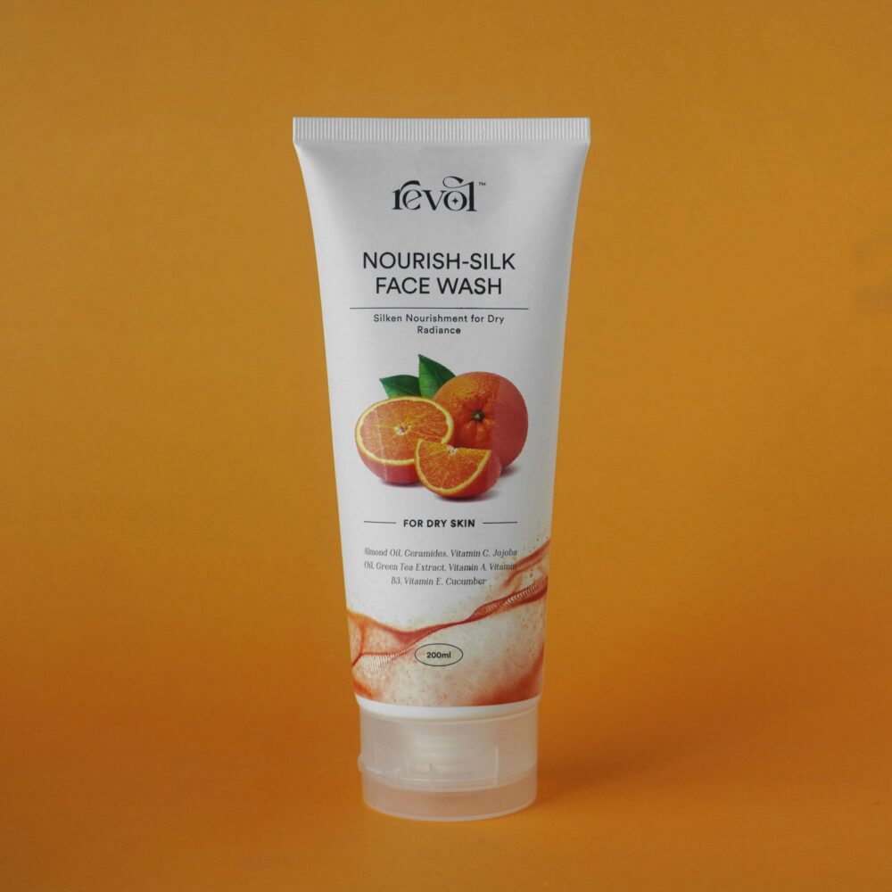 Nourish-Silk Face Wash for dry skin with a citrus backdrop